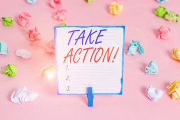 Fototapeta na wymiar Handwriting text Take Action. Conceptual photo do something official or concerted to achieve aim with problem Colored crumpled papers empty reminder pink floor background clothespin
