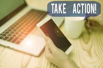 Text sign showing Take Action. Business photo showcasing do something official or concerted to achieve aim with problem woman laptop computer smartphone mug office supplies technological devices