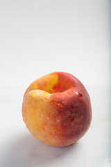 Fresh ripe peach on a marble table with copy area