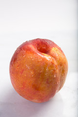 Fresh ripe peach on a marble table with copy area