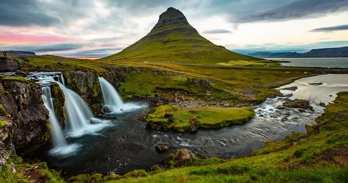 SEAMLESS LOOP VIDEO: Iceland timelapse photography of waterfall and famous mountain. Kirkjufellsfoss and Kirkjufell in northern Iceland nature landscape. Time lapse video in 4K - looping video.
