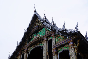 Beautiful thai temple decorated with sculptures an gold