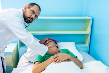 Doctor checking on his patient with his stethoscope