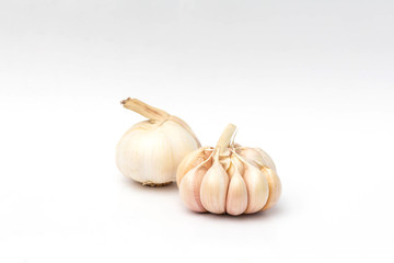 Two fresh garlic head on white background