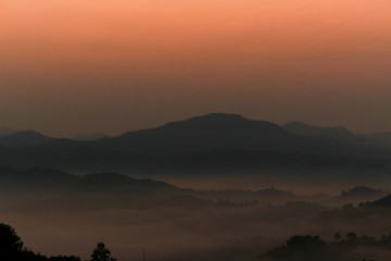 Beautiful scenery of mountain with  mist sea and sunrise sky at view point of Na Ton Chan in the early morning, Si Satchanalai, Sukhothai Province , Thailand.