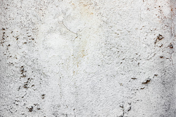 Texture of a concrete wall with cracks and scratches which can be used as a background