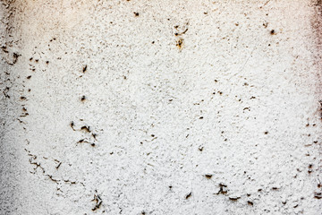 Texture of a concrete wall with cracks and scratches which can be used as a background