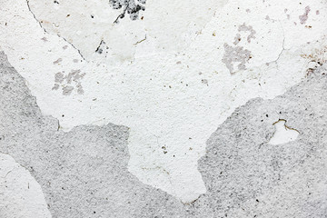 Texture of a concrete wall with cracks and scratches which can be used as a background