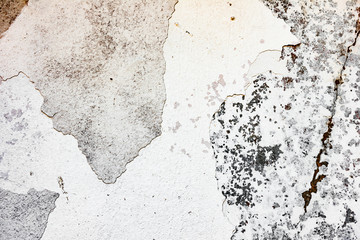 Texture of a concrete wall with cracks and scratches which can be used as a background
