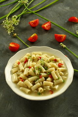 Top view- macaroni, pasta with vegetables and spices