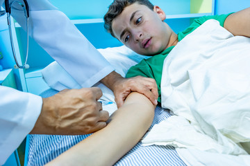 Doctor treating patient with needle