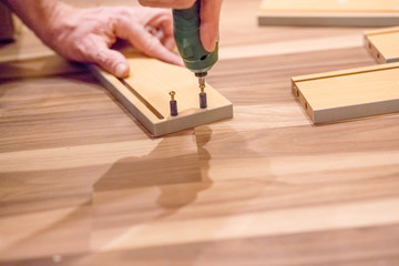 Man with screw gun or screwdriver, Building master, carpenter working with drilling machine,...