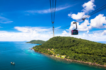 Naklejka premium Funicular sky cable car in Phu Quoc island ith blue sky and clear water in Southern Vietnam Indochina