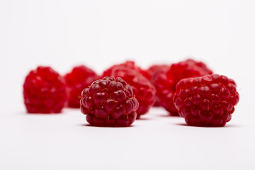 fresh raspberries on white background