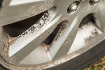 Corrosion of car rims. Peeling paint from metal. Chemical reaction. Disk recovery. Prolonged use.