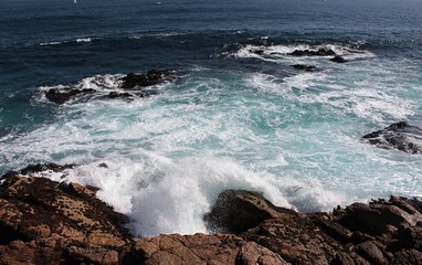 view of sea waves bursting on the rocks in Algarrobo beach in Chile