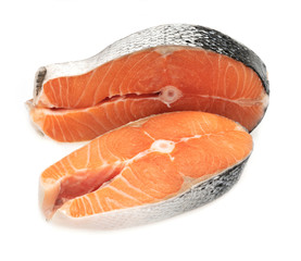 Raw salmon fillet slices, isolated on a white background.