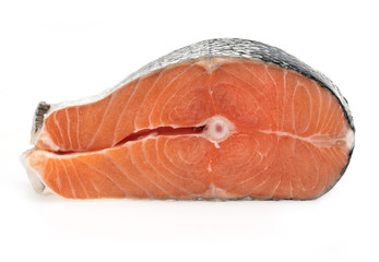 Raw salmon fillet slices, isolated on a white background.