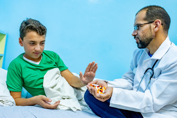 Doctor giving his patient some medicine