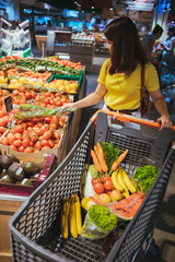 woman do shopping in city supermarket