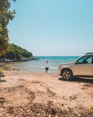 car travel concept man at summer beach looking at sea