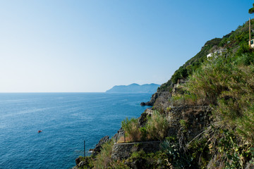 Riomaggiore Cliffs over the blue sea, Cinque Terre, La Spezia, Italy