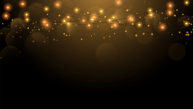 Christmas string lights on gold background