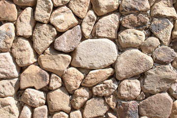 Old stone wall arranged pattern.