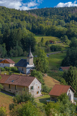 Fototapeta na wymiar Château-Lambert, France - 09 13 2019: Hike in the circuit of school trail. The church