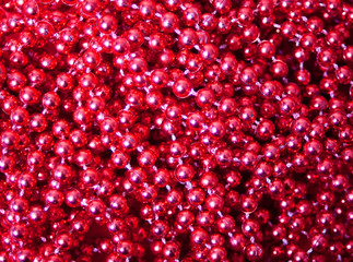 Red Christmas sparkle beads background texture pattern.