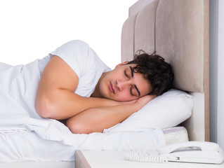 Man in bed suffering from insomnia