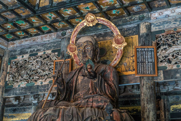 Obraz premium Kencho-ji temple 建長寺 Butsuden Hall Jizo Bosatsu statue 仏殿内. Ceiling ornaments of the Momoyama period style. Kamakura, Kanagawa Prefecture. Japan