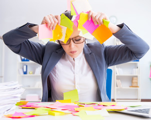 Businesswoman with conflicting priorities in office