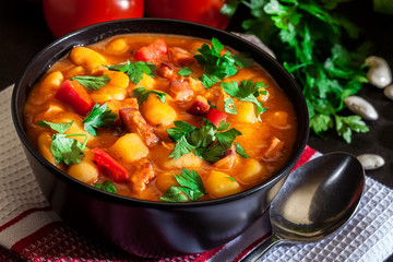 White bean soup with potatoes, tomatoes, paprika, and bacon
