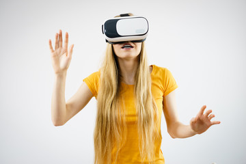Girl wearing virtual reality goggles.