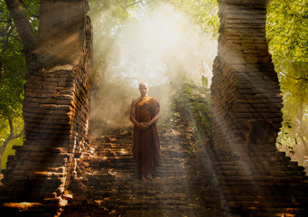 A Monks of Buddhism come to respect and make meditation in ancient buddha   a Buddhist temple...