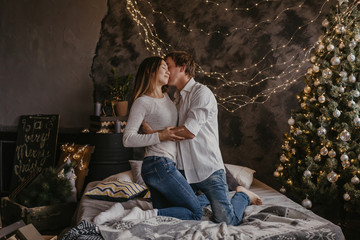 Obraz premium Romantic couple in love feeling happiness about their romance spending christmas eve together- Image