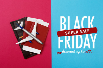 top view photo of toy airplane over color  background . Black friday sale
