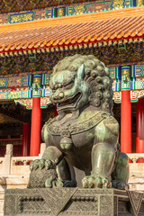 Fototapeta na wymiar Chinese guardian lion or shishi statue from Ming dynasty era, at the entrance to the palace in the Forbidden City, Beijing, China