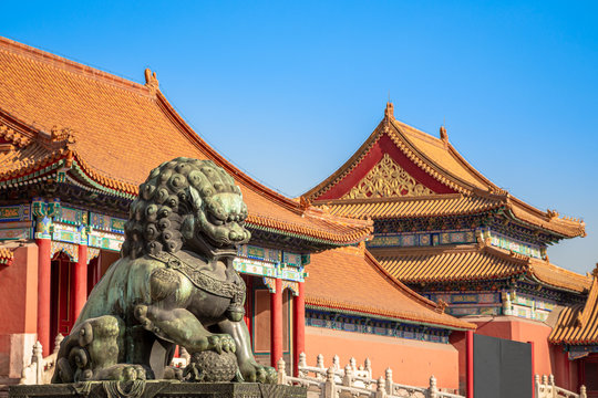 Chinese guardian lion or shishi statue from Ming dynasty era, at the entrance to the palace in the Forbidden City, Beijing, China