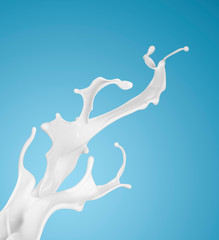 milk or white liquid splash on blue background.