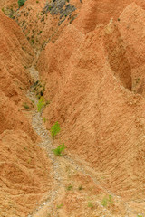 Valley eroded by rain and wind forming ravines in the red clay called Las Carcavas in Madrid