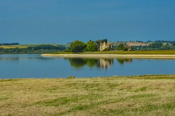 Low water at Rutland Reservoir showing shoreline and building ruins