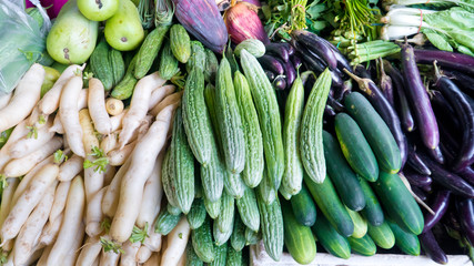 Various vegetables on the counter. organic fresh fruits and vegetables on grocery counter. Selling vegetables in Asia.