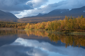 Fototapeta na wymiar Lake in autumn. Abisko national park in north of Sweden.