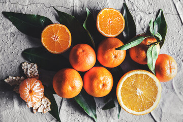 Citrus on table: mandarin, tangerine with a knife. Fresh organic juicy fruits.
