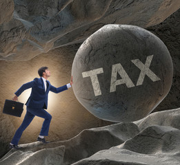 Businessman in high taxes business concept