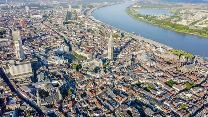  Antwerp, Belgium. Flying over the roofs of the historic city. Schelde (Esco) river. Cathedral of Our Lady of Antwerp. (Onze-Lieve-Vrouwekathedraal Antwerpen), Aerial View © nikitamaykov