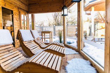 A row of wood beds ready for people to rest on them after sauna. Wellness.