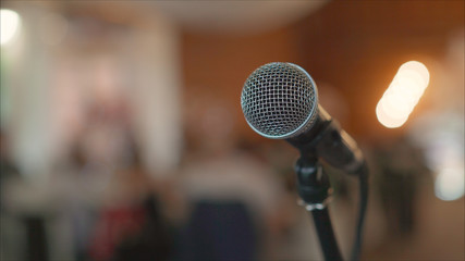 Microphone on stage against a background of auditorium. Stage microphone. Open microphone